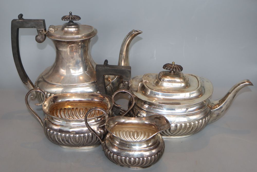 A George V demi-fluted silver four piece tea and coffee service, John Henry Potter, Sheffield, 1911, gross 65oz.